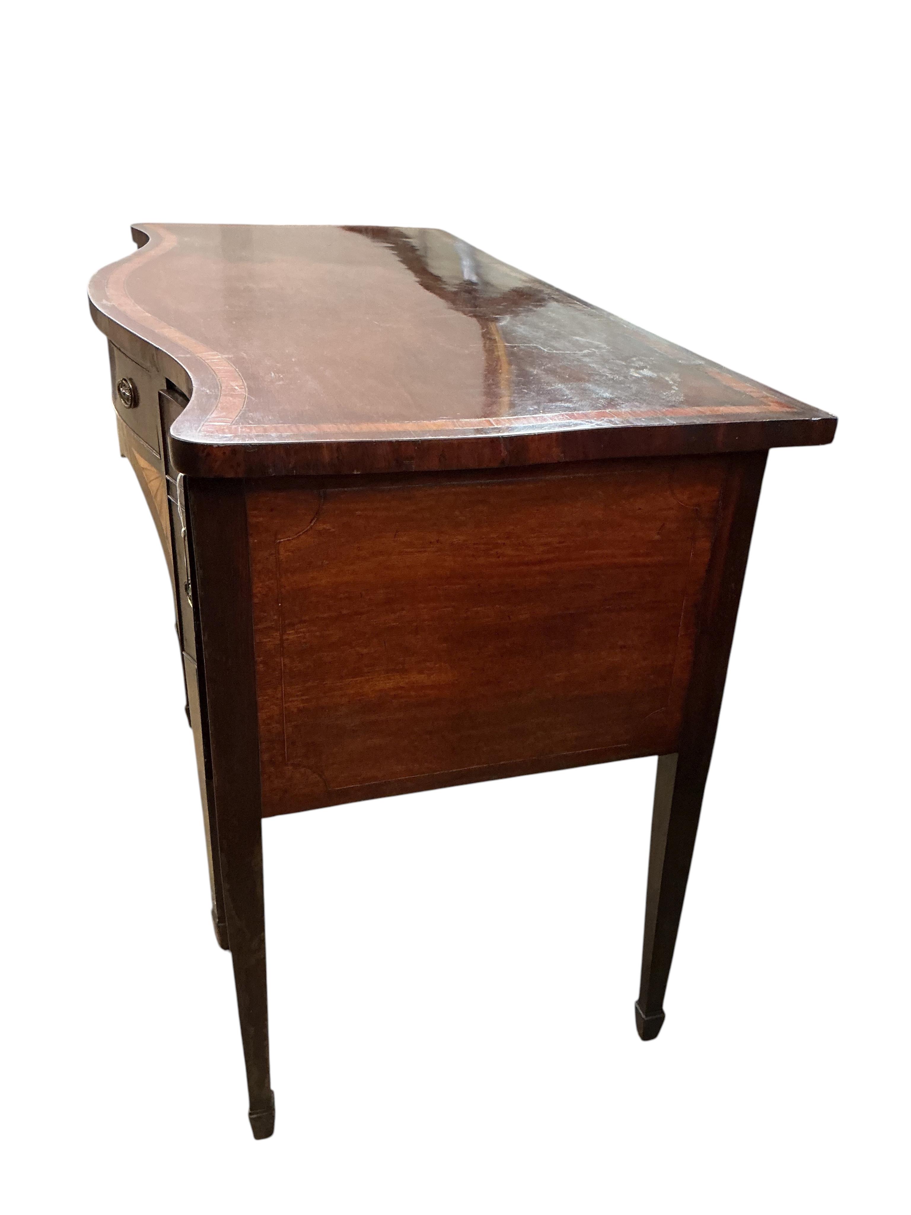A George III satinwood banded mahogany serpentine sideboard, width 138cm, depth 69cm, height 92cm